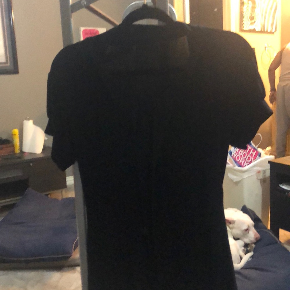Black blouse.  Form fitting to accentuate waist